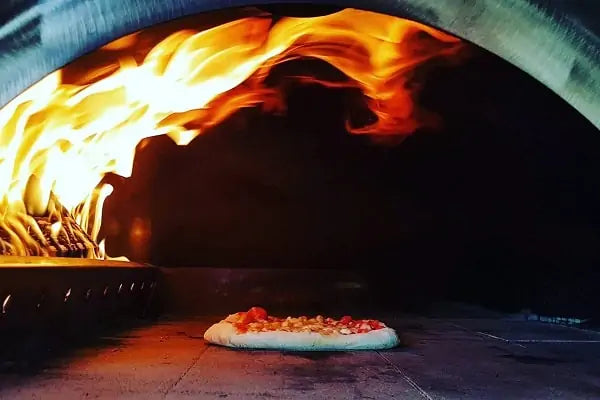Pizza oven cooking and real flame